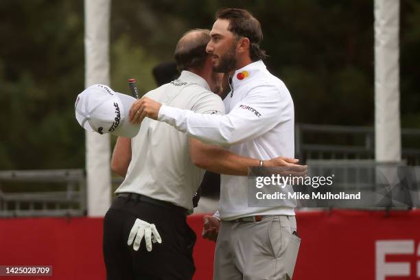 Max Homa of the United States hugs Danny Willett of England after winning the Fortinet Championship at Silverado Resort and Spa North course on...