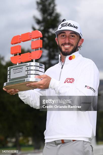 Max Homa of the United States celebrates with the trophy after winning the Fortinet Championship at Silverado Resort and Spa North course on...