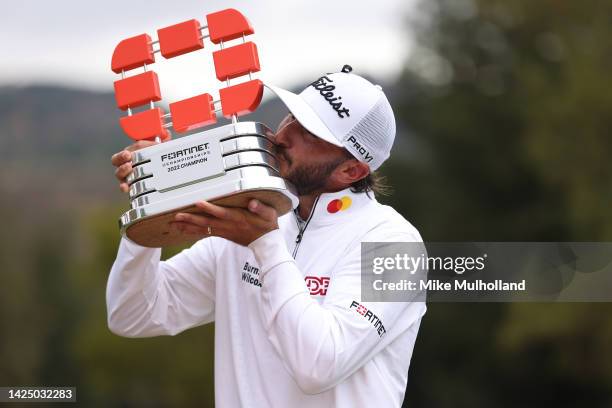 Max Homa of the United States celebrates with the trophy after winning the Fortinet Championship at Silverado Resort and Spa North course on...