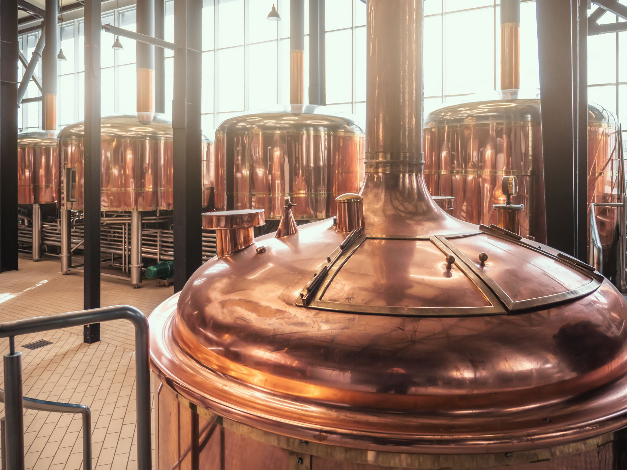 Brewery equipment. Brew manufacturing. Round cooper storage tanks for beer fermentation and maturation Brewery equipment. Brew manufacturing. Round cooper storage tanks for beer fermentation and maturation