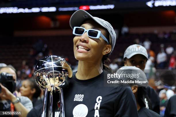 Ja Wilson of the Las Vegas Aces celebrates with the trophy after defeating the Connecticut Sun 78-71 in game four to win the 2022 WNBA Finals at...
