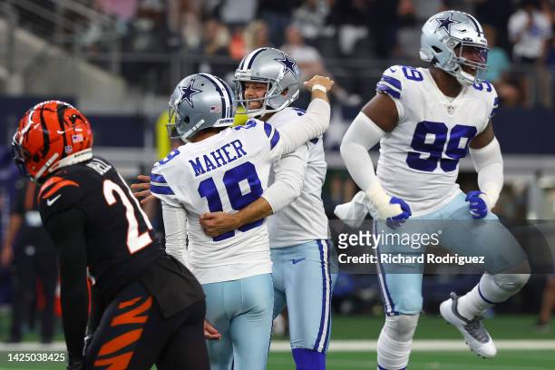 Brett Maher of the Dallas Cowboys celebrates with Bryan Anger after making a game-winning field goal against the Cincinnati Bengals during the fourth...