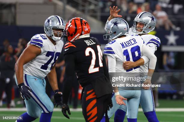 Brett Maher of the Dallas Cowboys celebrates with Bryan Anger after making a game-winning field goal against the Cincinnati Bengals during the fourth...