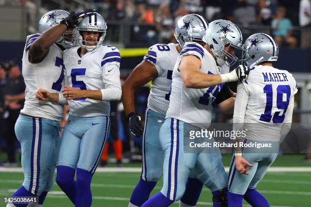 Brett Maher of the Dallas Cowboys is congratulated by Matt Waletzko after making a game-winning field goal against the Cincinnati Bengals during the...