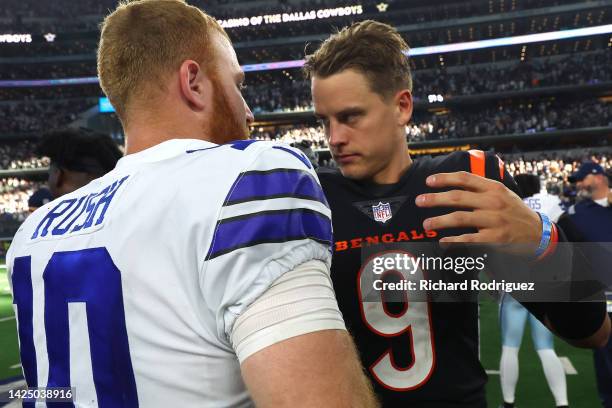 Cooper Rush of the Dallas Cowboys and Joe Burrow of the Cincinnati Bengals embrace after the game at AT&T Stadium on September 18, 2022 in Arlington,...