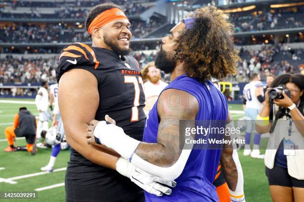 La'el Collins of the Cincinnati Bengals and Ezekiel Elliott of the Dallas Cowboys embrace after the game at AT&T Stadium on September 18, 2022 in...