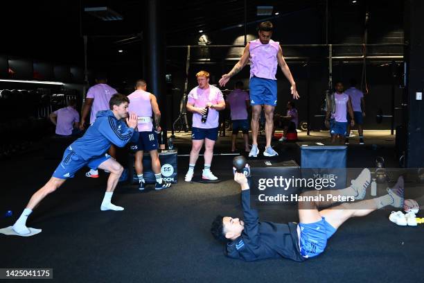 Beauden Barrett, Rieko Ioane and Stephen Perofeta of the All Blacks work out during a New Zealand All Blacks gym training session on September 19,...