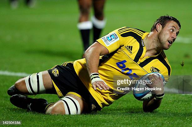 Jeremy Thrush of the Hurricanes scores a try during the round seven Super Rugby match between the Hurricanes and the Sharks at Yarrow Stadium on...