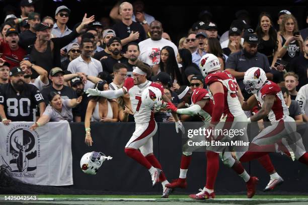 Byron Murphy Jr. #7 of the Arizona Cardinals celebrates with teammates after returning a fumble for a game-winning touchdown in overtime against the...