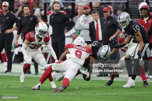 Isaiah Simmons of the Arizona Cardinals forces Hunter Renfrow of the Las Vegas Raiders to fumble the ball in overtime at Allegiant Stadium on...