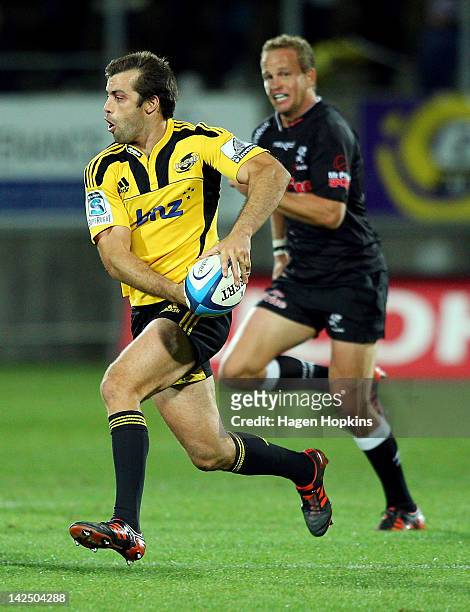 Conrad Smith of the Hurricanes makes a break during the round seven Super Rugby match between the Hurricanes and the Sharks at Yarrow Stadium on...