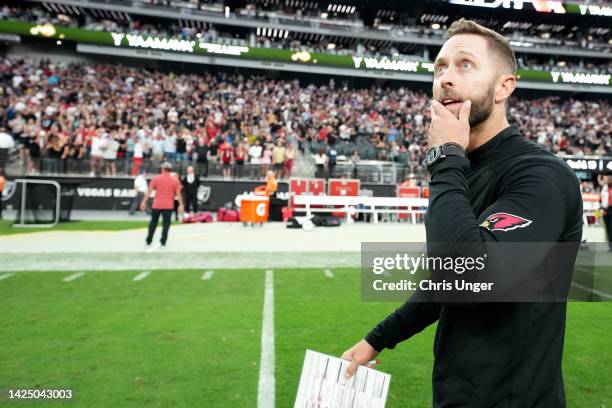 Arizona Cardinals head coach Kliff Kingsbury walks off the field after a 29-23 win in overtime against the Las Vegas Raiders at Allegiant Stadium on...