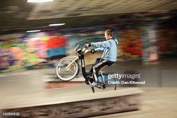 Boys pull stunts on 'Boris Bikes' at a skate park on the South Bank on April 5, 2012 in London, England. The flagship cycling scheme which comprised...