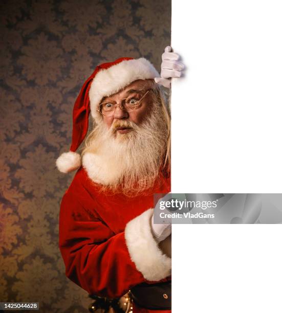 santa claus pointing on blank banner - santa hat and beard stock pictures, royalty-free photos & images