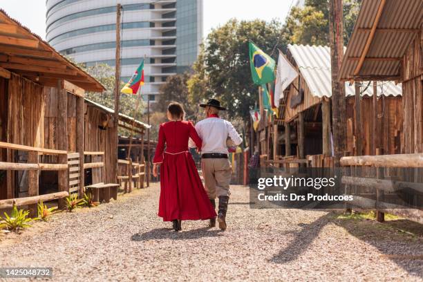 gaucho couple at the farroupilha camp - gaucho stock pictures, royalty-free photos & images