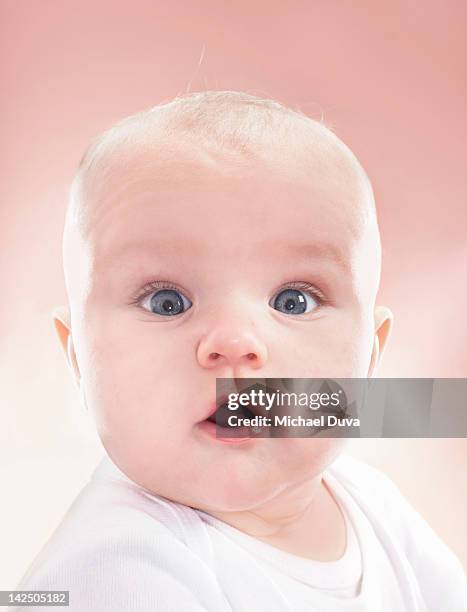 baby boy looking surprised and shocked - surprised baby stock pictures, royalty-free photos & images