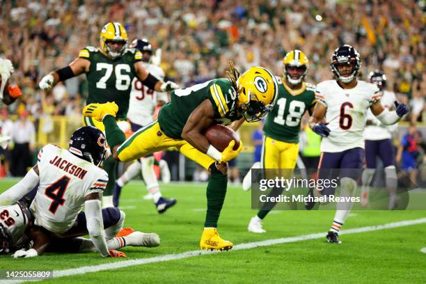 Aaron Jones of the Green Bay Packers scores a touchdown during the second quarter in the game against the Chicago Bears at Lambeau Field on September...