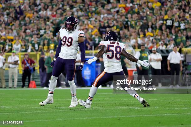 Trevis Gipson of the Chicago Bears celebrates a sack with Roquan Smith of the Chicago Bears during the first quarter in the game against the Green...