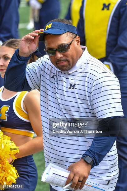 Former Player / Current Assistant Coach Mike Hart of the Michigan Wolverines is seen on the sideline before a college football game against the...