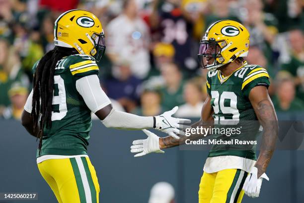 De'Vondre Campbell and Rasul Douglas of the Green Bay Packers react after a play during the second quarter in the game against the Chicago Bears at...