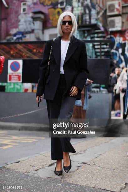 Sarah Harris is seen wearing a Black Blazer with a Pair of Black Denim Jeans, at David Koma during London Fashion Week September 2022 on September...