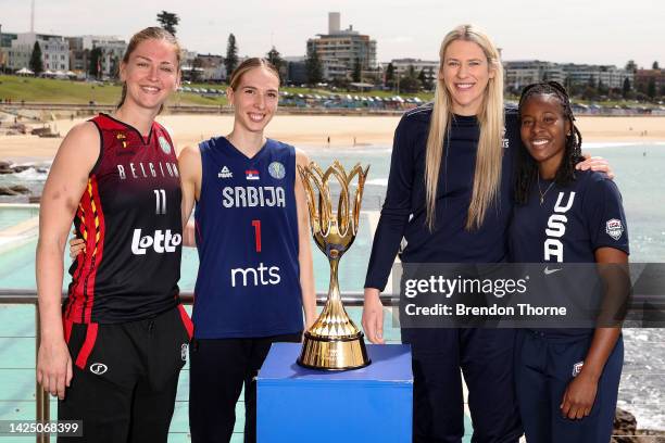 Emma Meesseman of Belgium, Ivana Raca of Serbia, Lauren Jackson of Australia and Ariel Atkins of USA pose next to the Women's Basketball World Cup...
