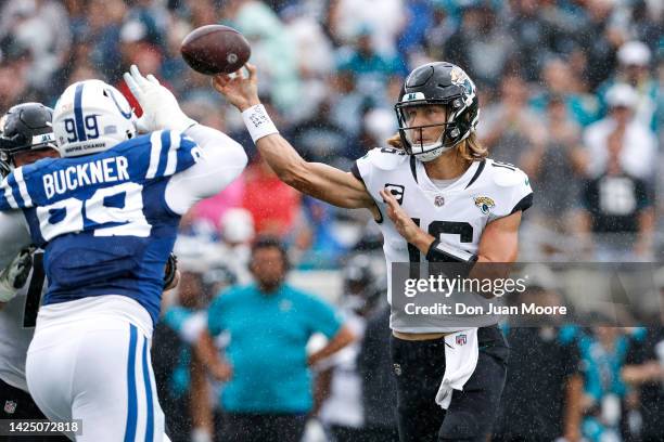Quarterback Trevor Lawrence of the Jacksonville Jaguars throws a pass over DeForest Buckner of the Indianapolis Colts during the game at TIAA Bank...