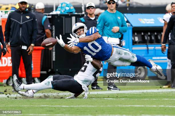 Wide Receiver Dezmon Patmon of the Indianapolis Colts attempts to make a diving catch over Cornerback Shaquill Griffin of the Jacksonville Jaguars...