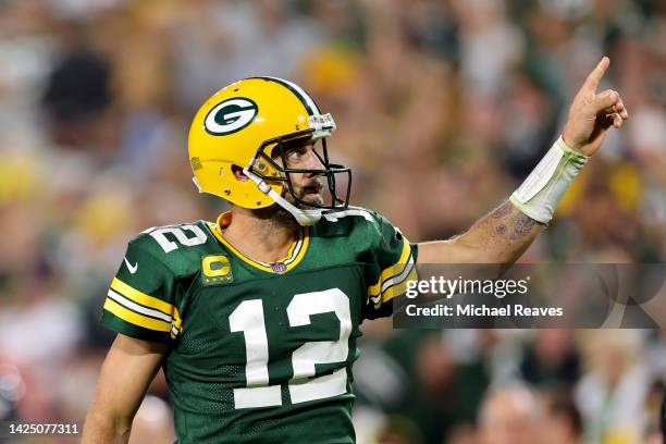 Aaron Rodgers of the Green Bay Packers reacts after a play during the fourth quarter in the game against the Chicago Bears at Lambeau Field on...