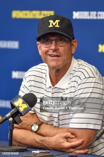 Head Football Coach Jim Harbaugh of the Michigan Wolverines speaks to press after a college football game against the Connecticut Huskies at Michigan...