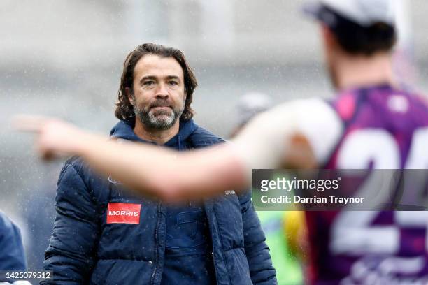 Chris Scott, Senior Coach of the Cats looks on during a Geelong Cats AFL training session at GMHBA Stadium on September 19, 2022 in Geelong,...