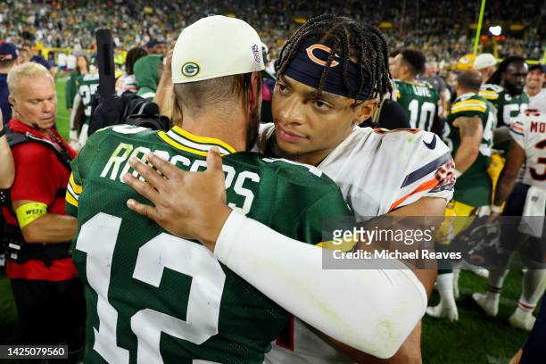 Aaron Rodgers of the Green Bay Packers and Justin Fields of the Chicago Bears embrace after the game at Lambeau Field on September 18, 2022 in Green...