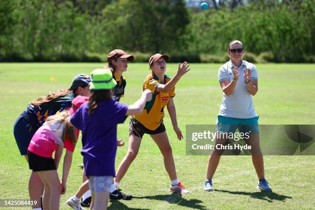 Jess Jonassen joins in on Junior/Master Blaster Games during Cricket Australia's Play Cricket Month Media Opportunity at Tivoli Sporting Complex on...