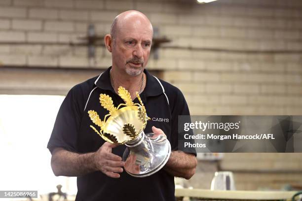 Vin Formosa completes the final touches as the 2022 AFL Premiership Cup Returns to Cash's Trophies To Get Its Final Polish Ahead of AFL Grand Final...