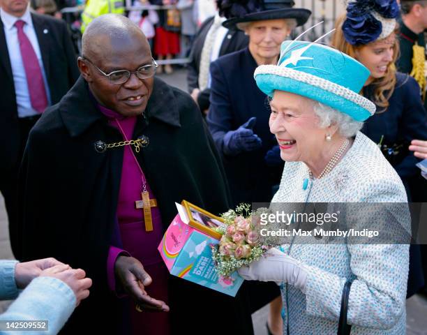 Queen Elizabeth II is presented with an Easter Egg by a member of the public during a walkabout outside the Mansion House whilst on a visit to York,...