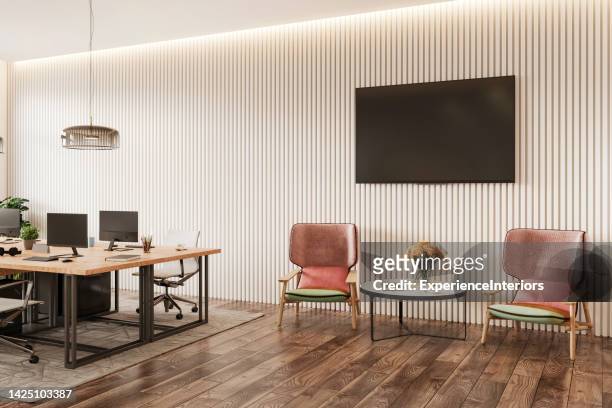 modern office space interior - tv on wall stockfoto's en -beelden