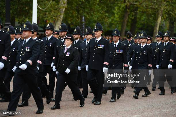 Metropolitan Police Officers are seen walking in formation down The Mall ahead of State Funeral Of Queen Elizabeth II on September 19, 2022 in...