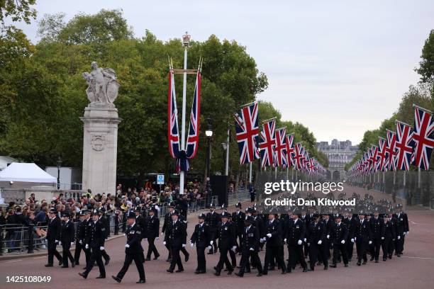 Metropolitan Police Officers are seen walking in formation down The Mall ahead of the State Funeral Of Queen Elizabeth II on September 19, 2022 in...