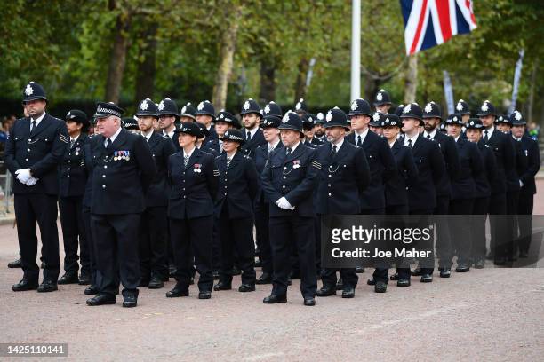 Metropolitan Police Officers are seen walking in formation down The Mall ahead of the State Funeral Of Queen Elizabeth II on September 19, 2022 in...