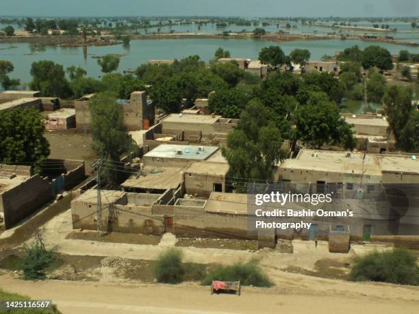 human settlement alongside of river - indus river flood stock pictures, royalty-free photos & images