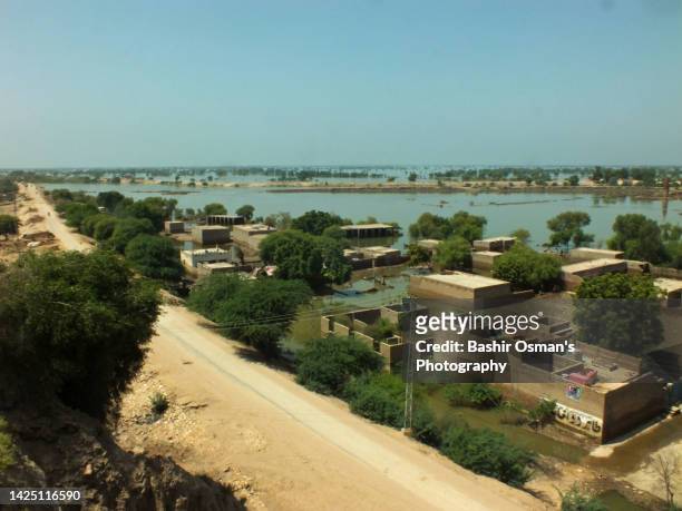 human settlement alongside of river - indus river pakistan stock pictures, royalty-free photos & images
