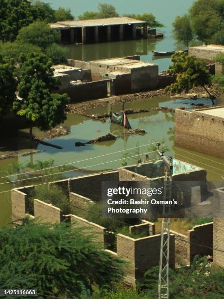 human settlement alongside of river - indus river flood stock pictures, royalty-free photos & images