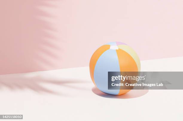 3d background render with a beach ball - beach ball stock pictures, royalty-free photos & images
