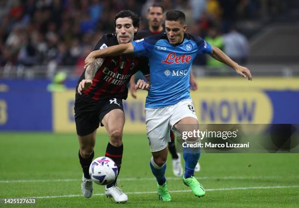 Sandro Tonali of AC Milan battles for possession with Giacomo Raspadori of SSC Napoli during the Serie A match between AC Milan and SSC Napoli at...