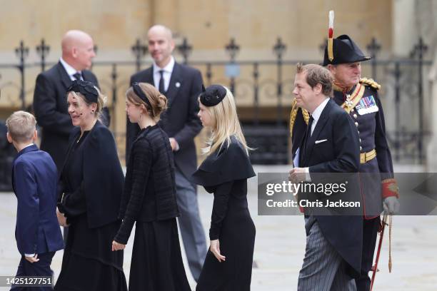 Children of the Queen Consort, Laura Lopes and Tom Parker Bowles arrive with their family at Westminster Abbey ahead of The State funeral of Queen...