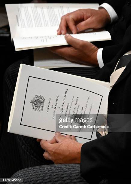 General view of guest holding the Order of Service inside Westminster Abbey ahead of the State Funeral of Queen Elizabeth II on September 19, 2022 in...