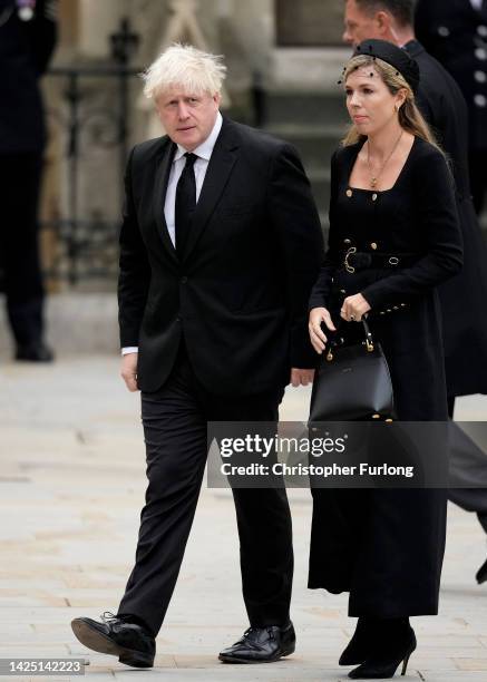 Former Prime Minister of the United Kingdom Boris Johnson and Carrie Johnson arrive at Westminster Abbey ahead of The State Funeral of Queen...