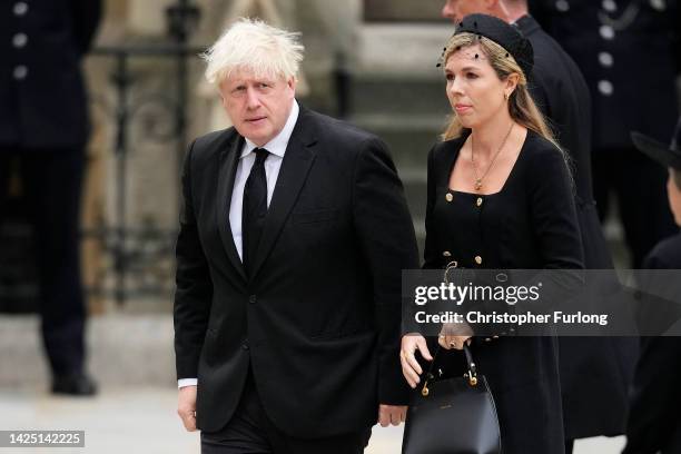 Former Prime Minister of the United Kingdom Boris Johnson and Carrie Johnson arrive at Westminster Abbey ahead of The State Funeral of Queen...