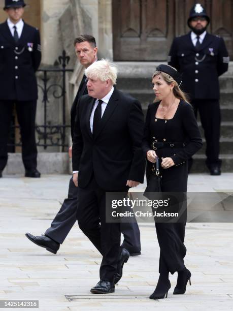 Former Prime Minister of the United Kingdom Boris Johnson and Carrie Johnson arrive at Westminster Abbey ahead of The State Funeral of Queen...