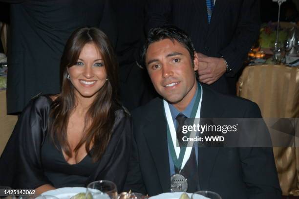 Millie Corretjer and Oscar de la Hoya attend the Eighteenth Annual Great Sports Legends Dinner Hosted By The Buoniconti Fund at the Waldorf Astoria...